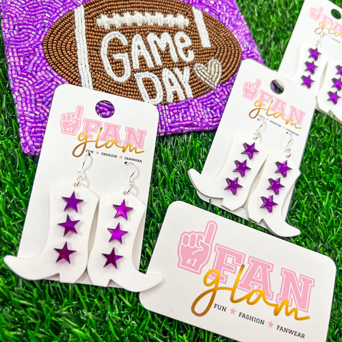 Showfams!!  Get Game Day Glam Ready When Wearing Our new 3-Star Boot Dangles.  Showcasing purple mirror stars on the iconic white boots, you can accessorize your Game Day style while showing support to your favorite Showgirl!