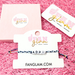 Stack your sorority spirit with the perfect arm candy to rep your sorority in style. &nbsp;Select our classic sorority braided strand for a simple, everyday vibe — or go full-on bold with our 4-strand stack, featuring a mix of stretchy beaded bracelets in fun colors and gold shimmer accents. &nbsp;

Whether you’re dressing up for bid day, big/little reveal, or just flexing your chapter pride, this set has you covered.&nbsp; Wear one or wear them all!