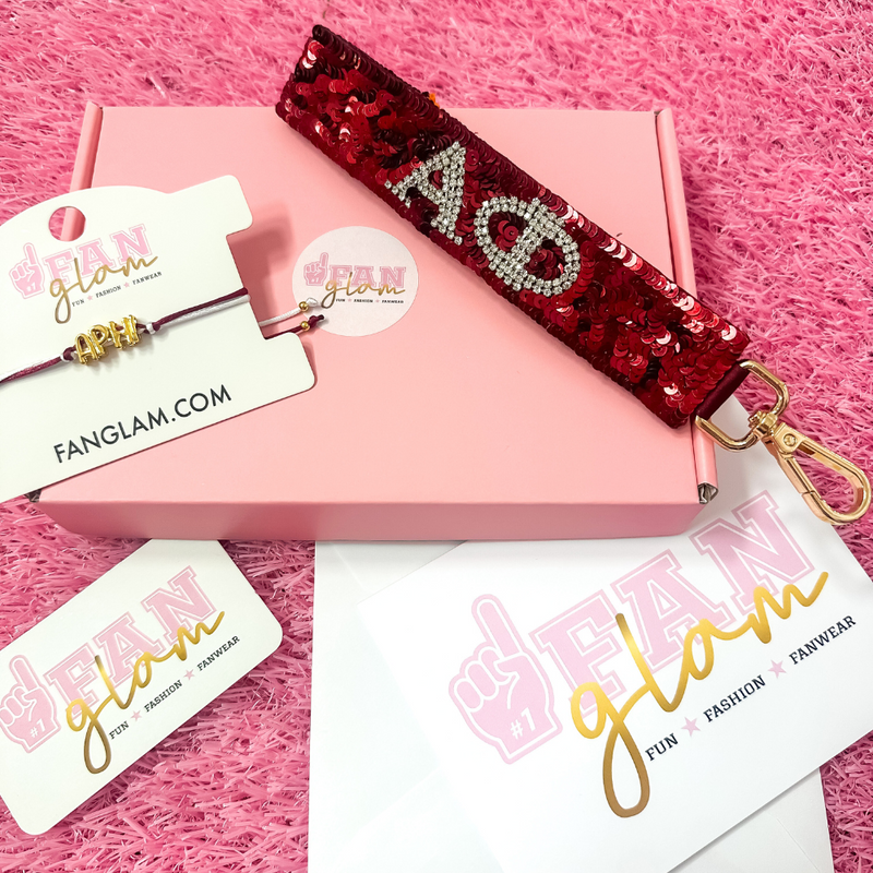 Welcome to sisterhood in style! Our Sorority Starter Glam Box is the perfect way to celebrate Bid Day or even Big/Little reveals!

Inside each Glam Box you’ll find a Sequin Greek Letter Wristlet/Keychain and a Gold Balloon Cinch Tie Bracelet &nbsp;accompanied with a personalized note where you can leave a custom message for your favorite sorority girl!

Whether you're new to Greek life or gifting your Little, this box is packed with spirit, sparkle, and sisterhood.&nbsp;