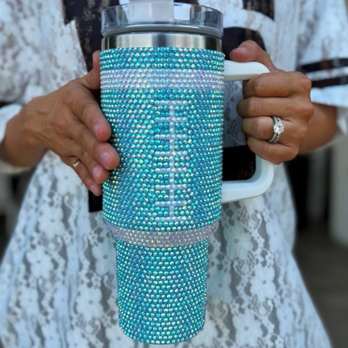 Sip in style on game day + every day!&nbsp; Add a touch of GAME DAY to any outfit with our AQUA CRYSTAL FOOTBALL "Blinged Out" Tumbler!

Indulge in your love for&nbsp;football season and show off your&nbsp;team&nbsp;spirit. These stylish accessories are the perfect addition to your game day fit.&nbsp;