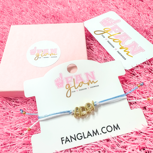 Our new cinch tie bracelets are the perfect pop of Greek glam — stackable, adjustable, and so on trend! Whether you are spoiling your Little, surprising your Big, or celebrating Bid Day, our gold letter greek bracelet adds just the right sparkle to every sorority moment.

With its comfy fit and meaningful charm, it's the go-to gift for your Greek fam — because sisterhood looks good on you!