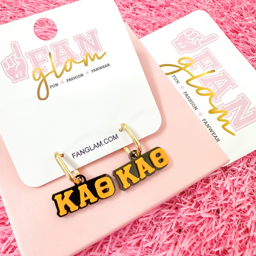 Wear your letters. Live your legacy. Love your style.

Add a little charm to your everyday look with our Kappa Alpha Theta Charmed Life Huggies!&nbsp;Featuring your Greek Letters in a bold yet dainty way, these lightweight huggie hoops are perfect for every moment, and made to celebrate your chapter all semester long.