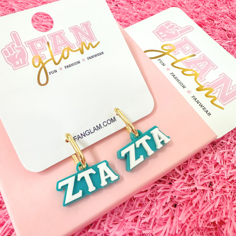 Wear your letters. Live your legacy. Love your style.

Add a little charm to your everyday look with our Zeta Tau Alpha Charmed Life Huggies! Featuring your Greek Letters in a bold yet dainty way, these lightweight huggie hoops are perfect for every moment, and made to celebrate your chapter all semester long.