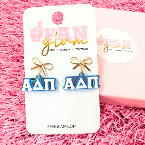Add a little glam to your Greek life with our Gold Bow Chapter Charms! These sweet drop earrings feature a dainty metallic bow paired with bold, bubbly sorority letters—perfect for Bid Day, Big/Little reveals, or just repping your chapter with style.