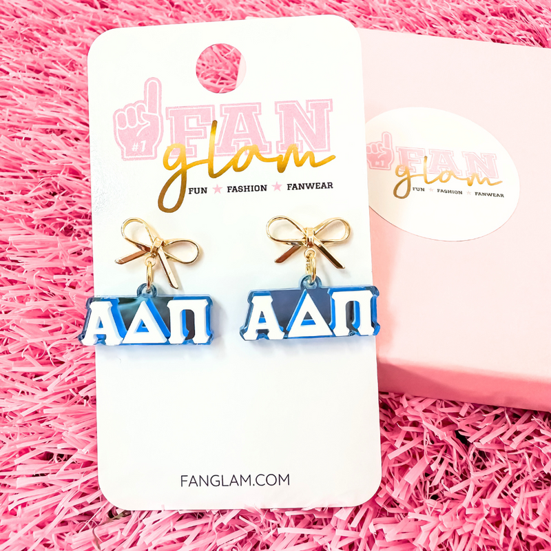 Add a little glam to your Greek life with our Gold Bow Chapter Charms! These sweet drop earrings feature a dainty metallic bow paired with bold, bubbly sorority letters—perfect for Bid Day, Big/Little reveals, or just repping your chapter with style.