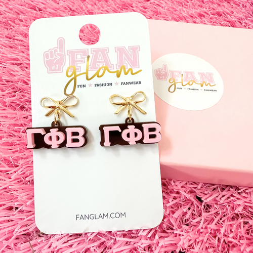 Add a little glam to your Greek life with our Gold Bow Chapter Charms! These sweet drop earrings feature a dainty metallic bow paired with bold, bubbly sorority letters—perfect for Bid Day, Big/Little reveals, or just repping your chapter with style.