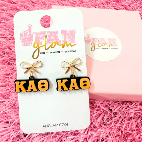 Add a little glam to your Greek life with our Gold Bow Chapter Charms! These sweet drop earrings feature a dainty metallic bow paired with bold, bubbly sorority letters—perfect for Bid Day, Big/Little reveals, or just repping your chapter with style.