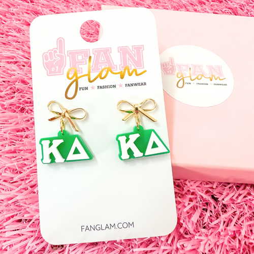 Add a little glam to your Greek life with our Gold Bow Chapter Charms! These sweet drop earrings feature a dainty metallic bow paired with bold, bubbly sorority letters—perfect for Bid Day, Big/Little reveals, or just repping your chapter with style.