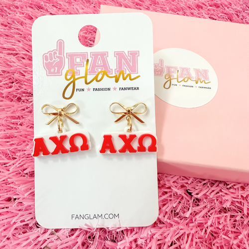 Add a little glam to your Greek life with our Gold Bow Chapter Charms! These sweet drop earrings feature a dainty metallic bow paired with bold, bubbly sorority letters—perfect for Bid Day, Big/Little reveals, or just repping your chapter with style.