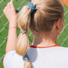 On Gameday, hold your hair and enhance your style with TELETIES. The strong grip, no rip hair tie that doubles as a bracelet. Strong, pretty, and stylish, TELETIES are designed to withstand everyday demands while taking your Gameday look to the next level.
