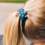 On Gameday, hold your hair and enhance your style with TELETIES. The strong grip, no rip hair tie that doubles as a bracelet. Strong, pretty, and stylish, TELETIES are designed to withstand everyday demands while taking your Gameday look to the next level.