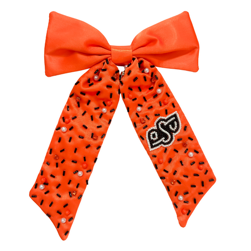 Add a splash of school spirit with our Logo Game Day Hair Bow. This fun accessory is bold and colorful, perfect for repping your school spirit in style. Whether for game day or everyday fun, this versatile hair bow brings a spirited touch to your collection.