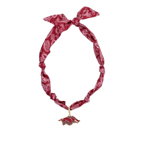 Show off your Razorbacks pride with this playful Arkansas Razorbacks Logo Bandana Scarf Necklace. Combining the charm of a bandana with the convenience of a necklace, it adds a fun, preppy twist to your game day outfit. Perfect for fans who want to keep their spirit stylish and standout wherever they go. Wooo Pig Sooie!