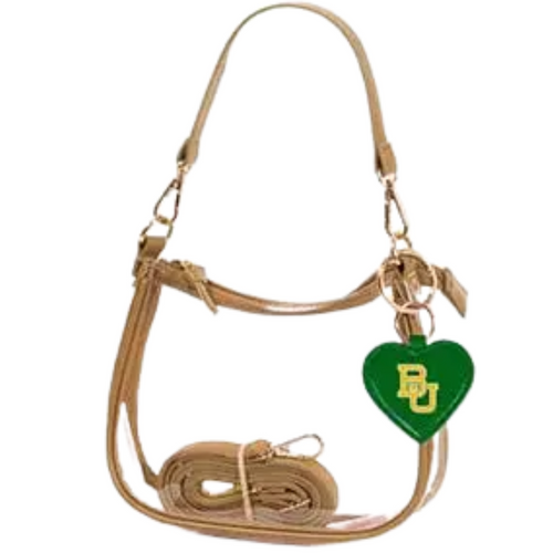 Our new Clara Clear Bag perfectly blends function and fashion, meeting stadium regulations with a chic design. It features a durable PVC body, secure zipper closure, and two interchangeable straps, keeping your essentials stylish and secure on game day.&nbsp;