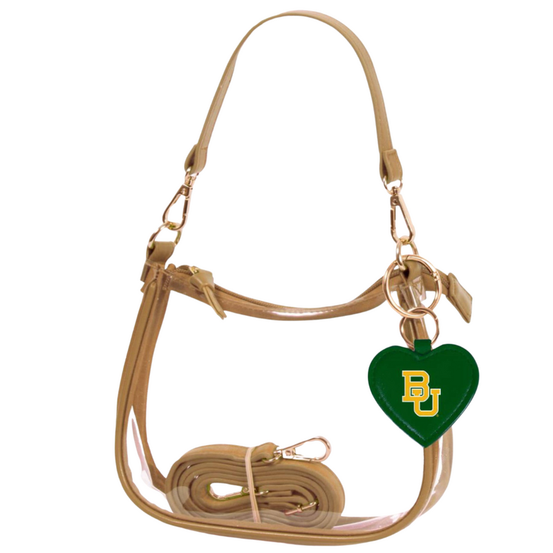Our new Clara Clear Bag perfectly blends function and fashion, meeting stadium regulations with a chic design. It features a durable PVC body, secure zipper closure, and two interchangeable straps, keeping your essentials stylish and secure on game day.&nbsp;