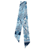 Wrap yourself in a playful, yet iconic one-of-a-kind piece in our silky scarflette! Vibrant blue and white florals dance alongside whimsical illustrations with hits of navy.&nbsp; This luxurious accessory captures the charm and heritage of Chapel Hill in every thread – perfect for locals and admirers of elegance alike. A wearable celebration of this historic community's unique character!