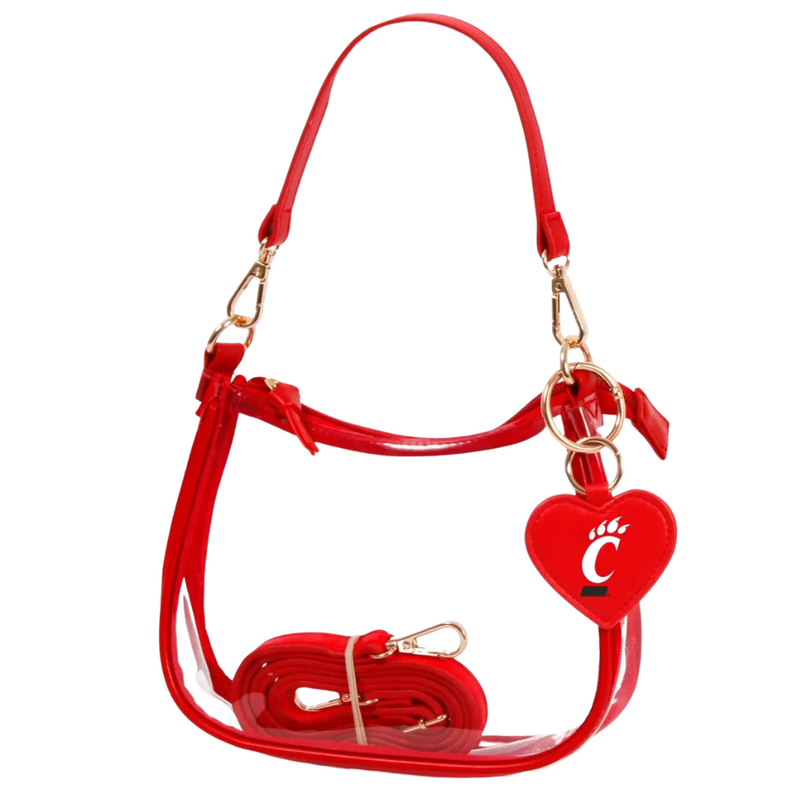 Our new Clara Clear Bag perfectly blends function and fashion, meeting stadium regulations with a chic design. It features a durable PVC body, secure zipper closure, and two interchangeable straps, keeping your essentials stylish and secure on game day.&nbsp;
