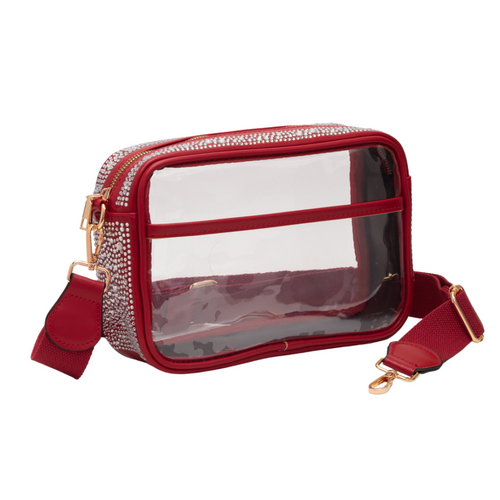 Glitter and Shine on the sidelines when styling your Game Day look with our NEW Rhinestone Clear Crossbody Zip Top Bag! &nbsp;

Featuring a clear PVC body adorned with rhinestones and gold metal accents.&nbsp; Comfortable and roomy, this bag is perfect for the Game Day girl who likes to come prepared!