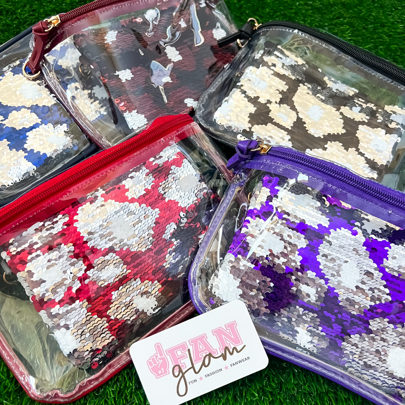 Sparkle + Shine On The Sidelines when you elevate your clear bag status and showcase this adorable reversible sequined wristlet / coin bag featuring seven iconic college team colors!  Stadium size approved and secure zip closure keeps your cash, credit card, lipstick and keys safe during the game!