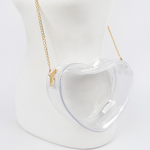 Fall in love with our newest GameDay stadium approved crossbody heart shaped bag.&nbsp;  Featuring a clear PVC body with a classic gold chain that can be easily removed to incorporate all your favorite team colored bag straps.