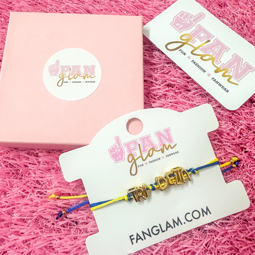 Our new cinch tie bracelets are the perfect pop of Greek glam — stackable, adjustable, and so on trend! Whether you are spoiling your Little, surprising your Big, or celebrating Bid Day, our gold letter greek bracelet adds just the right sparkle to every sorority moment.

With its comfy fit and meaningful charm, it's the go-to gift for your Greek fam — because sisterhood looks good on you!