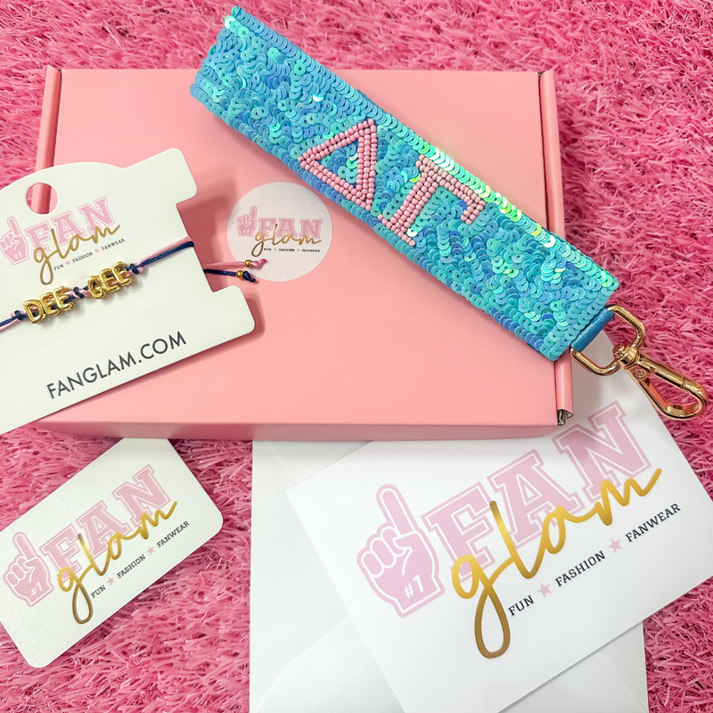 Welcome to sisterhood in style! Our Sorority Starter Glam Box is the perfect way to celebrate Bid Day or even Big/Little reveals!

Inside each Glam Box you’ll find a Sequin Greek Letter Wristlet/Keychain and a Gold Balloon Cinch Tie Bracelet &nbsp;accompanied with a personalized note where you can leave a custom message for your favorite sorority girl!

Whether you're new to Greek life or gifting your Little, this box is packed with spirit, sparkle, and sisterhood.&nbsp;