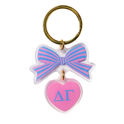 Add a splash of charm to your keys with the Bow-Dacious Key Chain! Featuring a delightful bow design accented with your sorority letters, this playful accessory is perfect for showing off your sisterhood pride in style. Compact and cute, it’s an ideal gift or a fun treat for yourself to keep your keys looking fabulous.