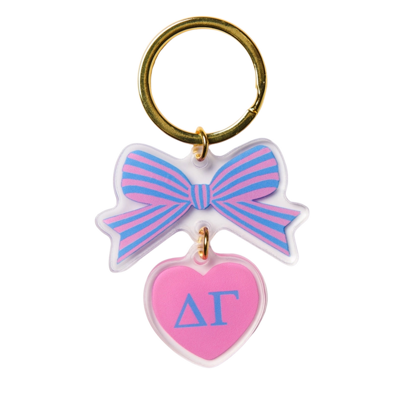 Add a splash of charm to your keys with the Bow-Dacious Key Chain! Featuring a delightful bow design accented with your sorority letters, this playful accessory is perfect for showing off your sisterhood pride in style. Compact and cute, it’s an ideal gift or a fun treat for yourself to keep your keys looking fabulous.