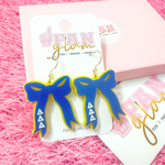 Add the perfect finishing touch to your Bid Day look with our Bid Day Bow Earrings! These bold, lightweight bows are designed to show off your chapter spirit with style and sparkle. Pair them with your favorite Bid Day fit for a look that's full of fun and sisterhood pride!