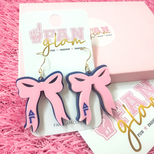 Add the perfect finishing touch to your Bid Day look with our Bid Day Bow Earrings! These bold, lightweight bows are designed to show off your chapter spirit with style and sparkle. Pair them with your favorite Bid Day fit for a look that's full of fun and sisterhood pride!