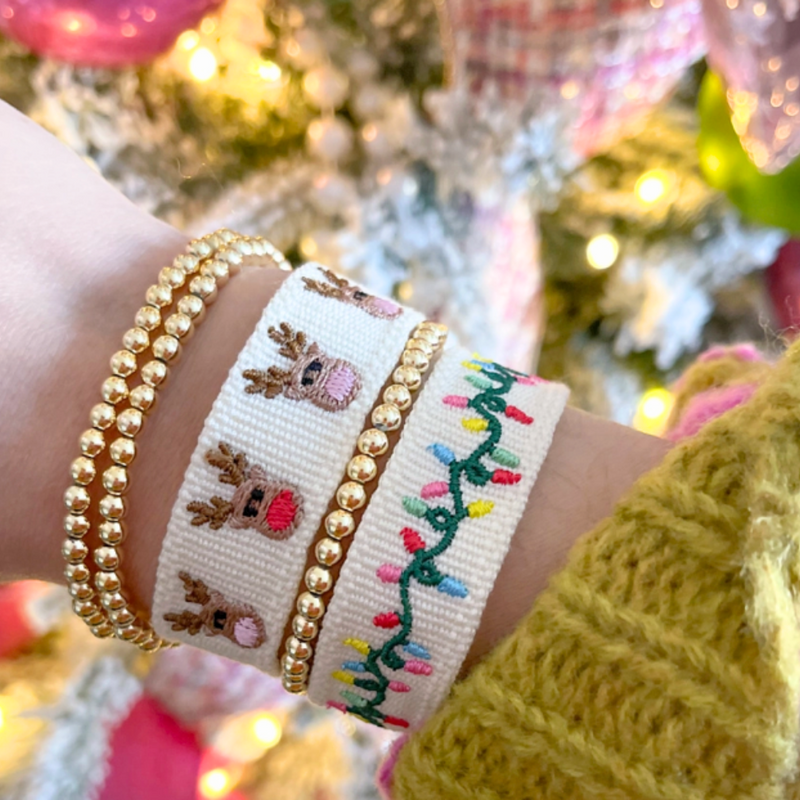 Cute as a button, don't let the holiday season pass you by without accessorizing your holiday attire with our new Reindeer Colored Nose tassel bracelet. &nbsp;Festive arm candy for all, it easily stacks with all your favorite holiday glam.&nbsp;&nbsp;