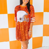 Sparkle and Shine while on the sidelines!  Show your love for the game and cheer on your favorite team in our NEW Helmet Sequin jersey!  It pairs perfectly with your favorite pair of white or black cowboy boots or when tailgate temperatures drop, add your favorite black leggings + booties and your game day ready!   Tunic dress is one size. Depending on body type, it may be worn as a dress, tunic with leggings or even as a top with jeans. 