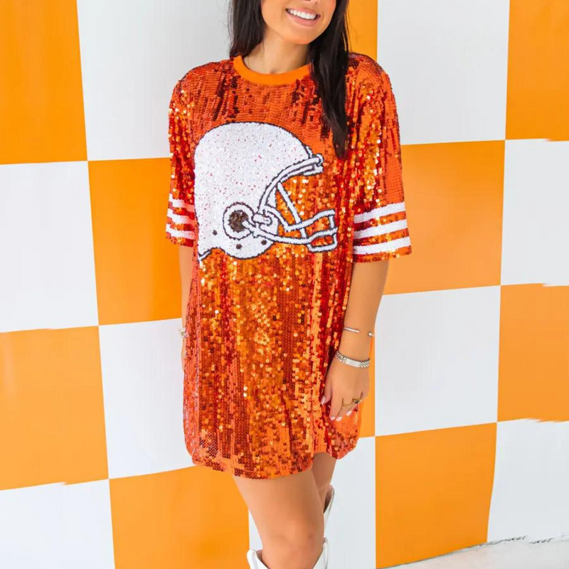 Sparkle and Shine while on the sidelines!  Show your love for the game and cheer on your favorite team in our NEW Helmet Sequin jersey!  It pairs perfectly with your favorite pair of white or black cowboy boots or when tailgate temperatures drop, add your favorite black leggings + booties and your game day ready!   Tunic dress is one size. Depending on body type, it may be worn as a dress, tunic with leggings or even as a top with jeans. 