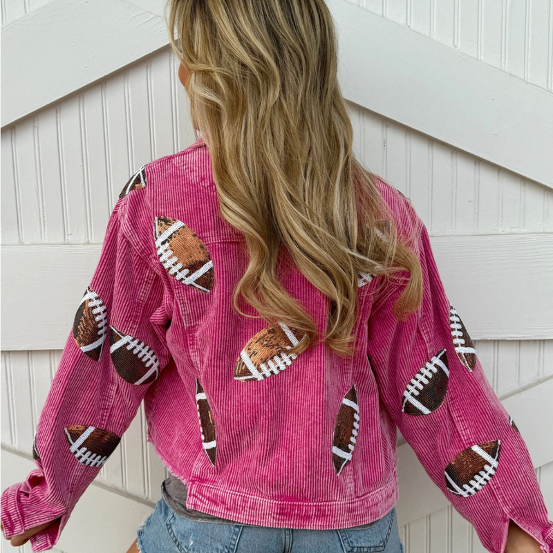 Step up your game day style with our Football Sequin Corduroy Jacket in hot pink! This vibrant, eye-catching color adds a fun twist to your sporty look, while the lightweight corduroy keeps you cozy during those cool fall days or early morning practices. Perfect for showing off your playful spirit, this jacket will have you shining bright and cheering loud in style. Get ready to turn heads and be the star of the stands!