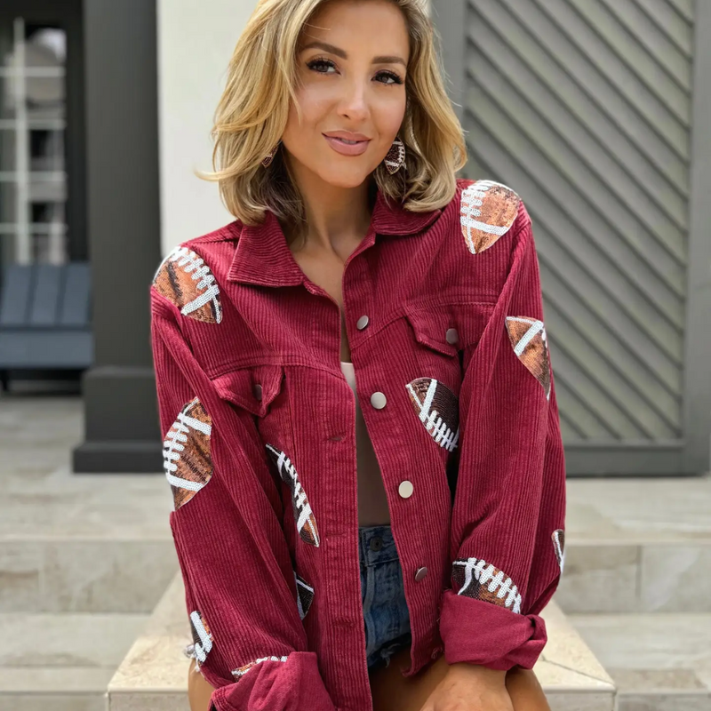 Step up your game day style with our Football Sequin Corduroy Jacket in Maroon! This bold, deep burgundy shade is sure to catch eyes in the crowd, while the lightweight corduroy keeps you comfy during those crisp fall days or early morning practices. Perfect for adding a playful, standout touch to your wardrobe, this jacket will have you feeling confident and ready to cheer on your team in style. Get ready to be the star of the stands!