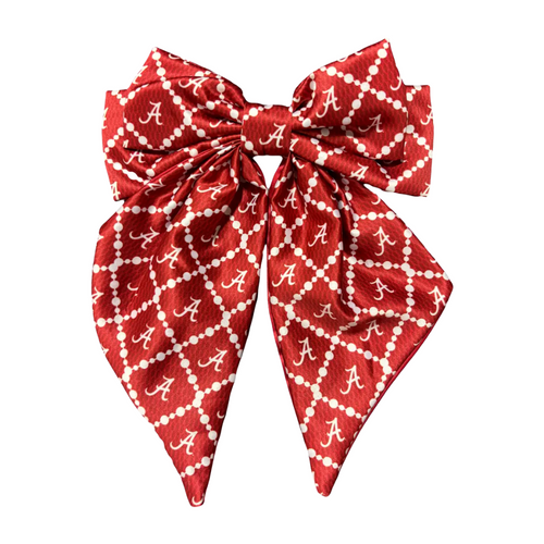 Add a splash of collegiate charm with the Fields Cape Cod Hair Bow. This playful accessory features a vibrant pattern that’s perfect for showing off your school pride. Whether for game day or everyday fun, this versatile hair bow brings a spirited touch to any look in your collection.