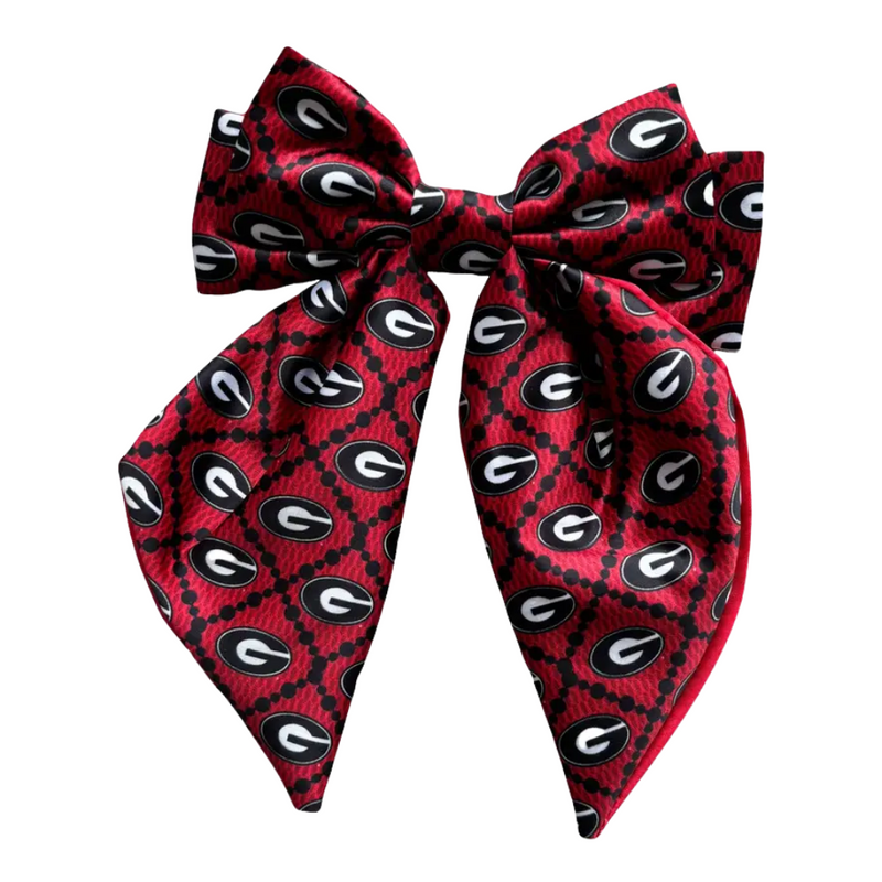 Add a splash of collegiate charm with our Satin Game Day Hair Bow. This playful accessory features a vibrant pattern that’s perfect for showing off your school pride. Whether for game day or everyday fun, this versatile hair bow brings a spirited touch to your collection.