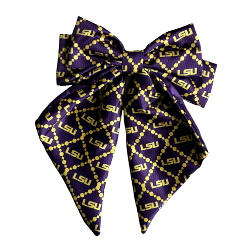 Add a splash of collegiate charm with our Satin Game Day Hair Bow. This playful accessory features a vibrant pattern that’s perfect for showing off your school pride. Whether for game day or everyday fun, this versatile hair bow brings a spirited touch to your collection.