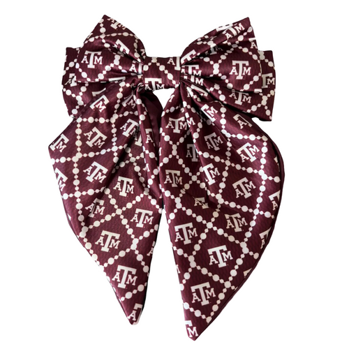 Add a splash of collegiate charm with our Satin Game Day Hair Bow. This playful accessory features a vibrant pattern that’s perfect for showing off your school pride. Whether for game day or everyday fun, this versatile hair bow brings a spirited touch to your collection.