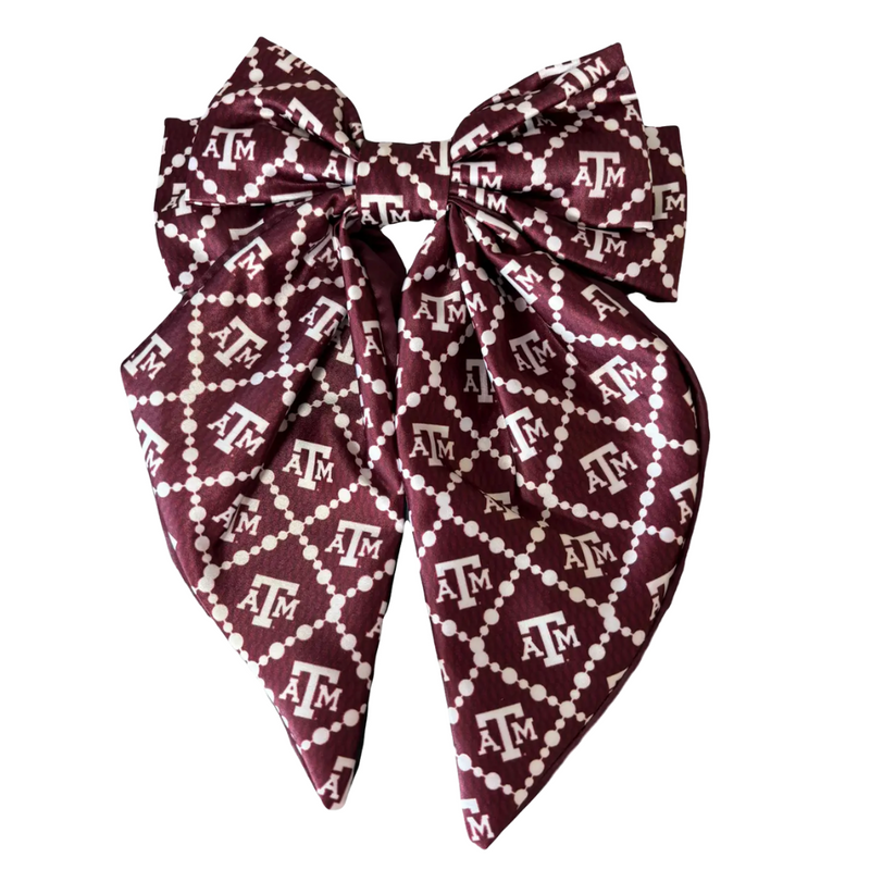 Add a splash of collegiate charm with our Satin Game Day Hair Bow. This playful accessory features a vibrant pattern that’s perfect for showing off your school pride. Whether for game day or everyday fun, this versatile hair bow brings a spirited touch to your collection.