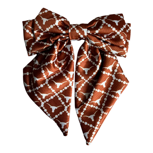 Add a splash of collegiate charm with our Satin Game Day Hair Bow. This playful accessory features a vibrant pattern that’s perfect for showing off your school pride. Whether for game day or everyday fun, this versatile hair bow brings a spirited touch to your collection.