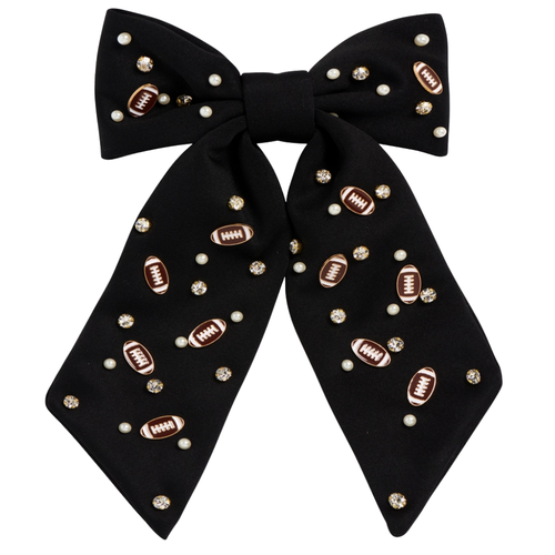 Bring a burst of team pride to any look with our Football Charm Game Day Hair Bow. Bright, bold, and full of school spirit, this eye-catching accessory has beautiful beading details with enamel football charms. Lightweight and versatile, it’s the perfect finishing touch for showing off your colors—on game day and beyond.