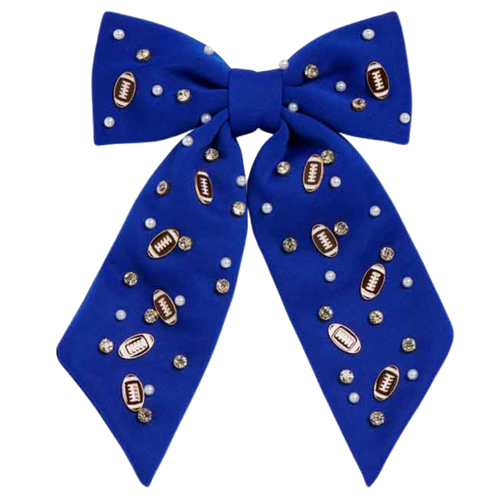 Bring a burst of team pride to any look with our Football Charm Game Day Hair Bow. Bright, bold, and full of school spirit, this eye-catching accessory has beautiful beading details with enamel football charms. Lightweight and versatile, it’s the perfect finishing touch for showing off your colors—on game day and beyond.