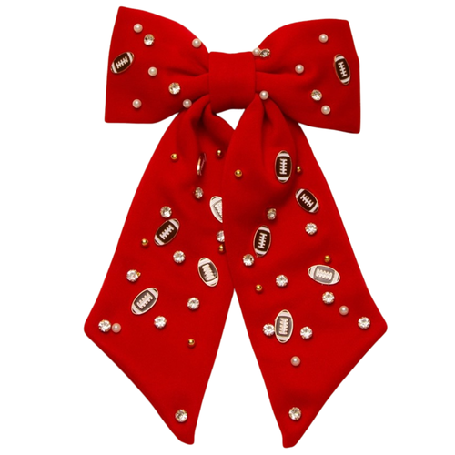 Bring a burst of team pride to any look with our Football Charm Game Day Hair Bow. Bright, bold, and full of school spirit, this eye-catching accessory has beautiful beading details with enamel football charms. Lightweight and versatile, it’s the perfect finishing touch for showing off your colors—on game day and beyond.