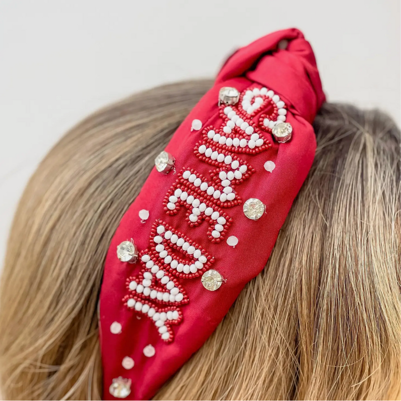 Our NEW rhinestone be-jeweled "Game Day" headbands, feature a trendy knotted design and are adorned with sparkling rhinestones and dual colored beads arranged in a playful "Gameday" pattern.  This headband is perfect for showing off your team spirit at sporting events, tailgates, or any other gameday celebration. 