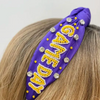 Our NEW rhinestone be-jeweled "Game Day" headbands, feature a trendy knotted design and are adorned with sparkling rhinestones and dual colored beads arranged in a playful "Gameday" pattern.  This headband is perfect for showing off your team spirit at sporting events, tailgates, or any other gameday celebration.  