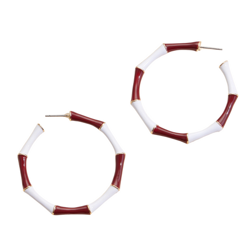 Elevate your Gameday outfit with these stunning maroon and white enamel hoop earrings. Designed to add a touch of elegance and team spirit to any outfit, these earrings feature a sleek and modern design that will complement both casual and formal attire. &nbsp;Available in 6 classic team colors.