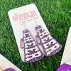 There's no better time to accessorize your Game Day look.  Get GLAM ready with us in our new Glitter Glam Purple/White Collection.  Available in three collectable styles.