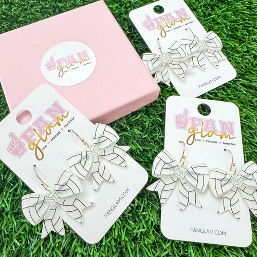 Elevate your court side style in our new sporty and chic Glitter Glam Volleyball Bow Dangles.&nbsp; A new Game Day favorite that adds a little sparkle and shine to your game day fit.