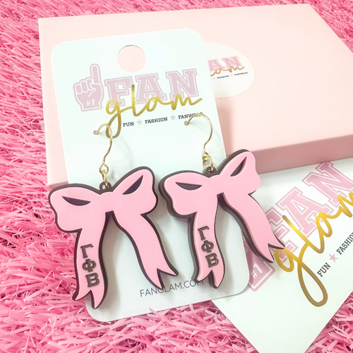 Add the perfect finishing touch to your Bid Day look with our Bid Day Bow Earrings! These bold, lightweight bows are designed to show off your chapter spirit with style and sparkle. Pair them with your favorite Bid Day fit for a look that's full of fun and sisterhood pride!